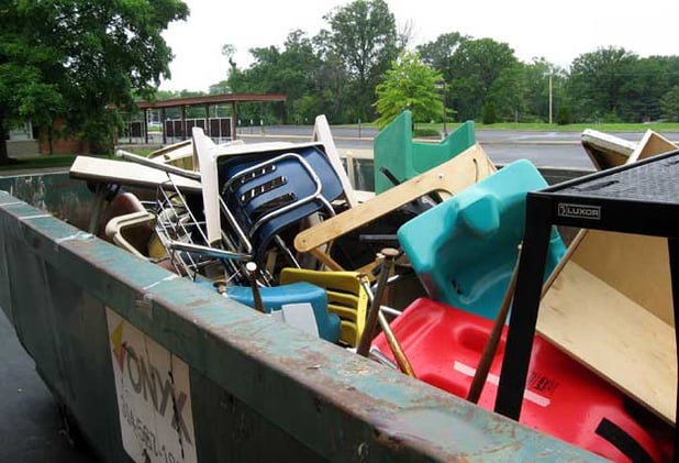 chairs in a skip dumpster.jpg