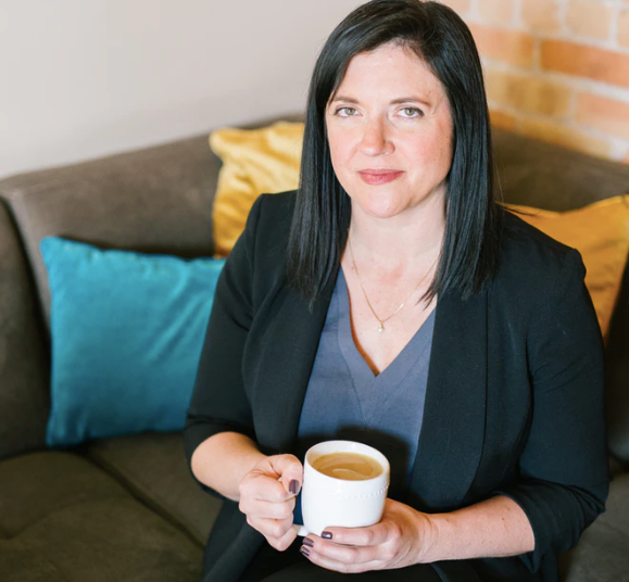 woman holding cup of coffee sitting on sofa photo – Free Human Image on Unsplash